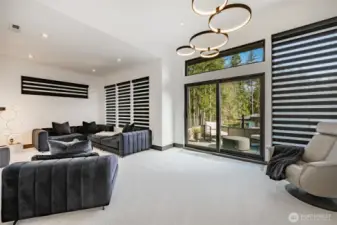 Upper level TV/game room, with private blackout blinds and outdoor deck.