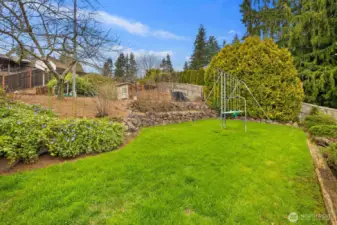 Fully fenced yard with playset