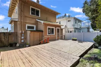 Small lower window is the main unit bedroom, large lower window is the lower unit kitchen.  Large upper window is the upper unit kitchen.  Shared yard and small storage shed for yard tools.