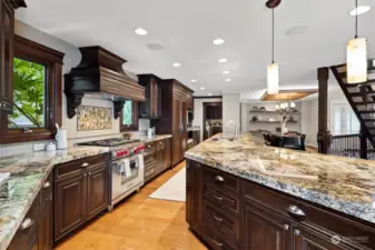 Gourmet chef's kitchen features expansive island, double-thick granite counters and top-of-the-line multiple Wolf and Sub-Zero appliances