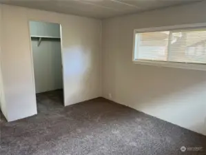 Primary bedroom looking at walk in closet.