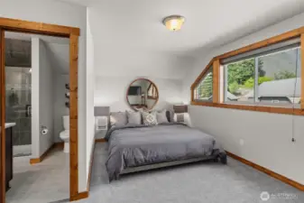 Upstairs bedroom w/ ensuite bath.
