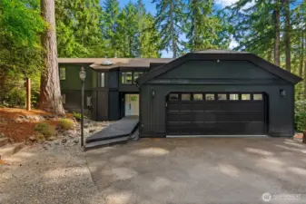 This beautifully upgraded custom home blends modern comforts with timeless charm, offering a truly elevated living experience. Nestled on an expansive lot adorned with mature trees and lush landscaping, the property provides a peaceful, private retreat ideal for multi-generational living or rental income.