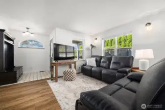 The formal living room and the entire main floor has new LVT flooring. The floor plan is open and spacious.