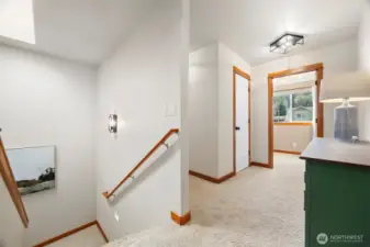 At the top of the stairway you will see the hallways are wide as well as the stairs.