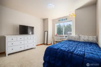 The second bedroom also looks out toward the front of the home and is quite large.