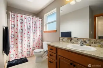 There is a full bath with a large single sink vanity upstairs.