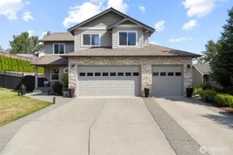 The home has stone and shingle accents, as well as a spacious 3 vehicle garage.