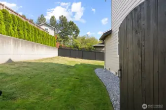This is the side yard through the opened gate.