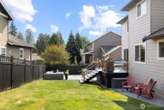 Another view of the rear yard with the back deck that had new stairs, railings and skirting done this year.