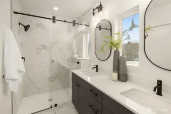 Primary bathroom features a two sink quartz vanity and a ceramic tile walk-in shower