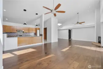 Open Concept Layout  A modern open-concept floor plan highlights high ceilings, abundant natural light, and a perfect flow between kitchen, dining, and living areas.
