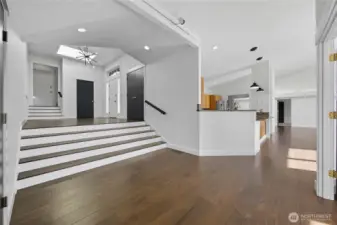 Open Concept Layout -   A modern open-concept floor plan highlights high ceilings, abundant natural light, and a perfect flow between kitchen, dining, and living areas.