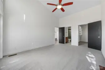 Primary Bedroom #2 - This versatile secondary suite features vaulted ceilings, oversized windows, and direct access to the private deck, blending indoor comfort with outdoor tranquility.