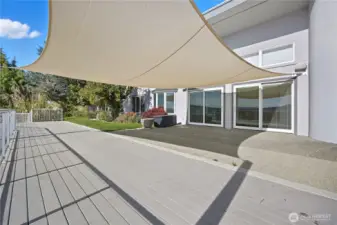 Patio -   Expansive patio shaded by a stylish sail canopy — ideal for outdoor dining, lounging, or hosting gatherings while taking in scenic views.