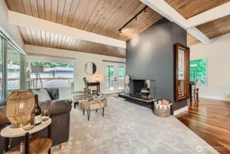 Just beyond the living and dining rooms, french doors open up to the large outdoor deck