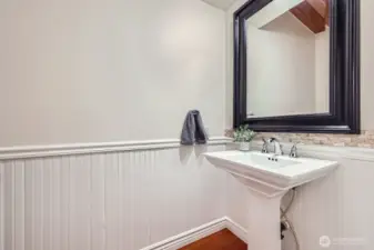 Half bathroom located off the kitchen