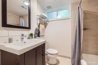 Hall bathroom has a tub