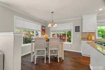 Large breakfast nook, ideal for busy mornings. Breakfast nook overlooks the lush backyard.