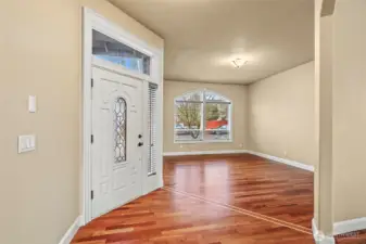 Entry way, nice wide foyer and front living room. Inlayed Brazillian Cherrywood floors.