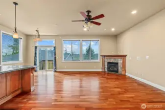 Kitchen with easy flow into family room, gas fireplace.