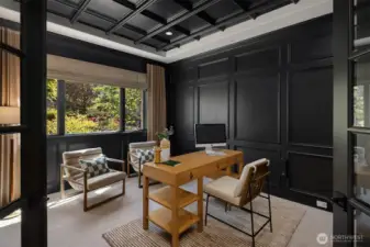 Just off the entry, a sophisticated home office provides an inspiring space to work or study.