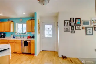 Entrance with kitchen and to Great Room on right and hall to bedrooms on the left