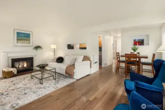 Formal living room off the front entry with cozy two sided fireplace