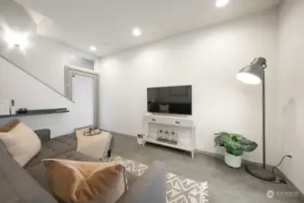 Living room seamlessly connected to kitchen.