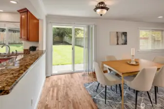 Sliding glass doors that open to the newly landscaped, fully fenced backyard.