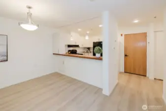 Extra storage on living room side of kitchen with pull-out drawers.