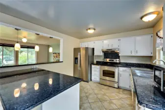 Love this kitchen!  Granite countertops and open to the living room.  French doors lead to expansive back deck with access to the backyard.