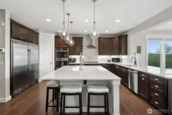 Yes, the massive fridge/freezer stays!