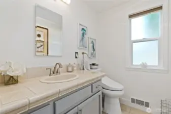 Half Bath between Kitchen and Laundry Room.