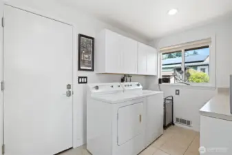 Laundry Room and access to the oversized Garage.