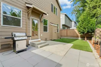 Grill is attached and stays with the home.  Never buy a propane tank again.