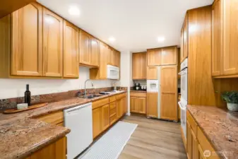 Ample countertop space, double oven, and generous storage throughout.