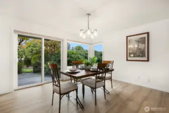 Dining area opens directly to private patio and garden space. Perfect indoor-outdoor flow.