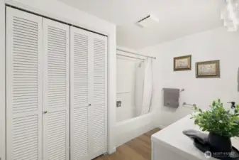 Spacious full bath with refreshed vanity, lighting, and durable LVP flooring.