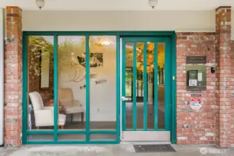 Controlled-access main entry with intercom and welcoming lobby with elevator.