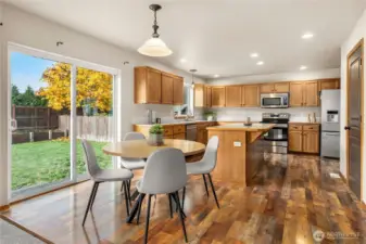 Bar seating and eating area w/ slider door to the backyard