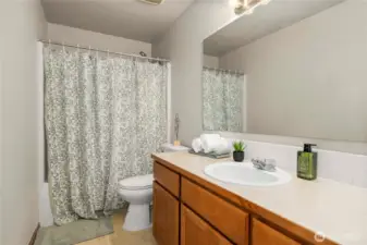Full bathroom upstairs with tub