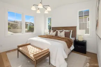 Primary suite easily fits king sized bed