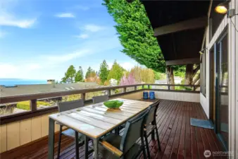 Amazing panoramic westerly views from upper level deck off family room and kitchen