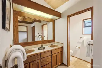 Primary ensuite bathroom with separate toilet and shower room
