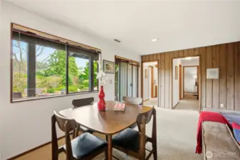 Lower level den provides wonderful entertaining spaces with table and seating areas