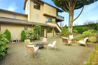 Large rear patio with mature trees and plantings