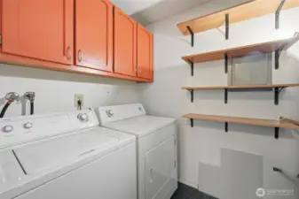 Full Size Utility Room with Additional Shelving and Cabinet Space. Washer and Dryer Included!
