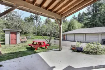 View from covered patio to your detached 4-bay shop!