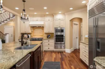 SubZero refrigerator, Viking six-burner gas stove, and two (2) Bosch dishwashers
